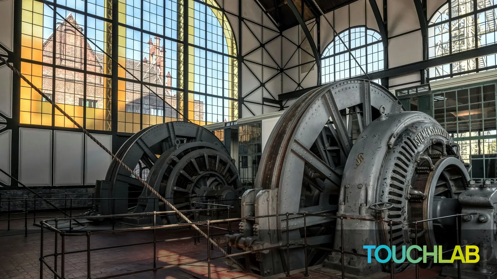 Wolfgang Weiser - https://unsplash.com/photos/a-large-metal-machine-sitting-inside-of-a-building-vEZH5p6GuIo